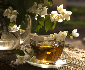 jasmine tea in a glass cup on the old background