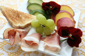 Appetizer with Serrano ham and fruits