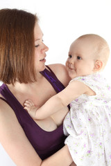 Mother keeps on hand a little baby