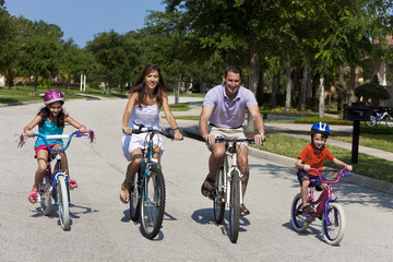 Fototapeta premium Modern Family Parents and Children Cycling