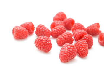 handful of fresh raspberries isolated on white background