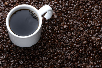 Cup of coffee with beans