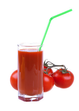 Glass of fresh tomato juice with tomatoes