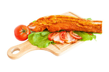 Pork fillet on wood, arranged and isolated on white