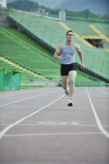 Fototapeta na wymiar young athlete running