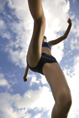 Fototapeta premium woman jogging at athletics stadium