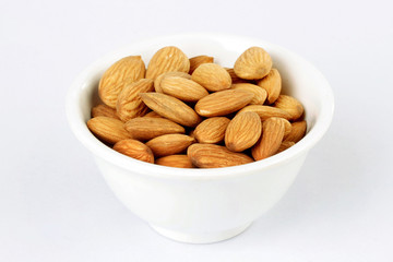 Fresh almonds ina  white bowl