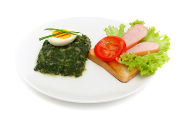 sauteed spinach, egg and sandwich for breakfast isolated on whit