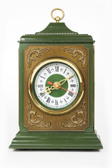 old antique clock brown and green color isolated on white