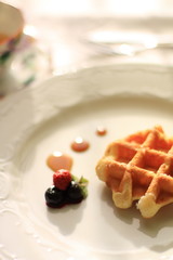 Waffle with blueberry and syrup