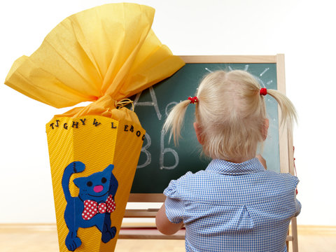 Cute blond girl starts of school