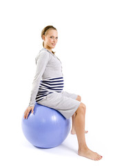 Young pregnant woman exercising
