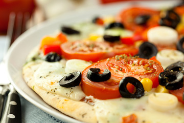 Pizza with mozzarella cheese and vegetables