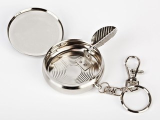 Small pocket ash-tray isolated on white background