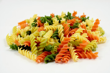 colored macaronis isolated on white background