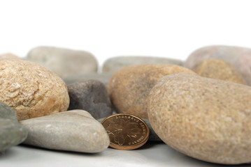 Fototapeta na wymiar coin in stones