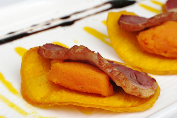 Duck meat, sweet potato puree on chip (Selective Focus)