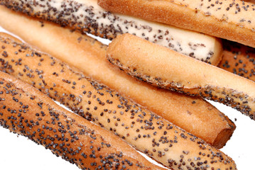 Salted breadsticks with poppy seed isolated on white
