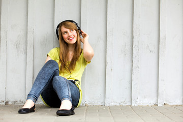 Teenage girl wearing headphones