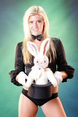 Cute magician and bunny popping out her top hat