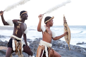 african traditional men on beach