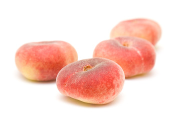 donut peaches isolated on white (Paraguayos; Saturn Peaches; Chi