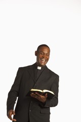 A Man Wearing A Clerical Collar And Laughing