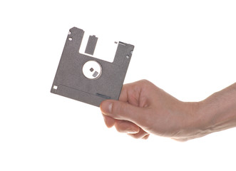 hand with a floppy disk isolated on white background