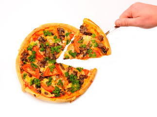 Hand holding slice of a pizza