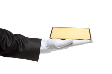 A gloved hand holding a gold bar isolated on white