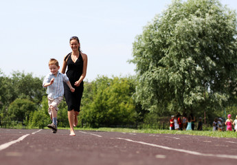 Fototapeta premium Happy mother and her little son outdoors session