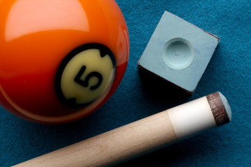 Pool ball, cue stick and chalk