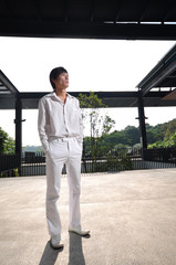 Asian Man in white in deep thoughts