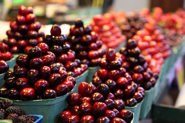 Cherries piled up in pyramids in a food market