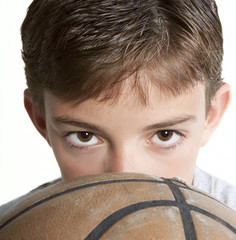 Youth Looking Over Basketball