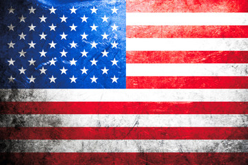 Obraz premium This grunge American flag features a heavily weathered and distressed texture, with vintage stars and stripes on a rough, dirty background surface.