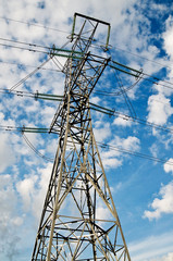 Wonderful blue sky and electrical pylon.