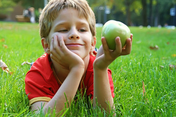 Boy with an green apple
