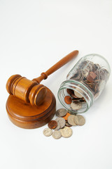 legal gavel and assorted coins in a jar