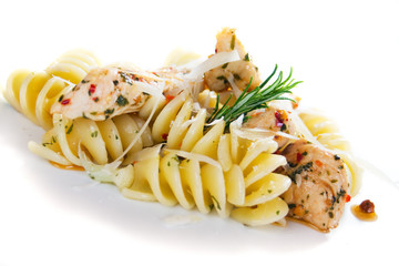 Pasta with chicken meat isolated on white