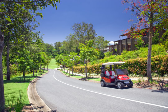 Golf Estate with forrest and course with Buggy in the foreground