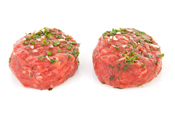 raw german beef over white background