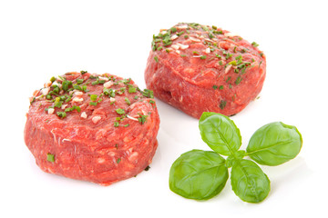 raw german beef over white background