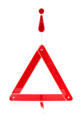 reflective road hazard warning triangle over white background