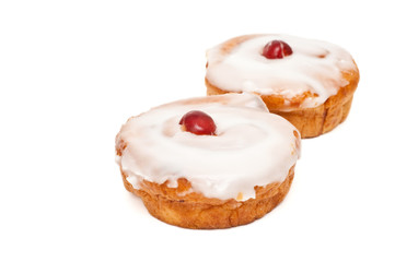 cakes with cherry on top isolated