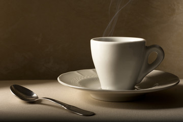Coffee Cup with Spoon on Beige
