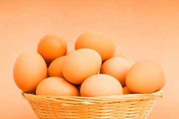 Basket of eggs on the colourful background