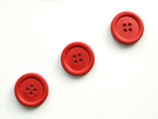 three red buttons on white background