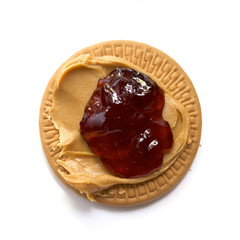 peanut butter and strawberry jam on biscuit
