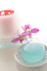 Obraz na płótnie Canvas Ocean blue herb soap and aroma candle